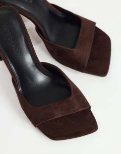Model wearing Walter high heeled mule in chocolate faux suede