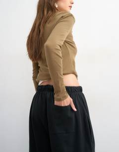 Model wearing Washed long line tie detail shorts in black