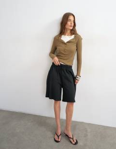 Model wearing Washed long line tie detail shorts in black