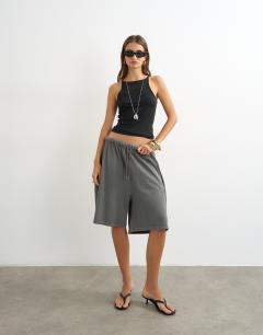 Model wearing Washed long line tie detail shorts in washed charcoal