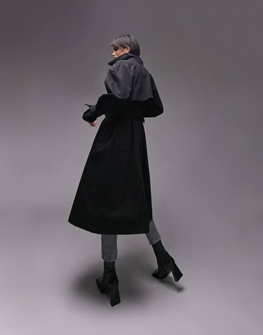 Topshop washed black cotton trench coat. It has classic trench coat styling with Notch lapels, a Button placket, Tie waist and Side pockets. It has a Regular fit and a midi length. 