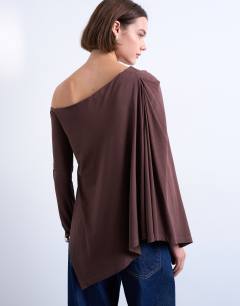 Model wearing Waterfall cape one shoulder long sleeve top in chocolate