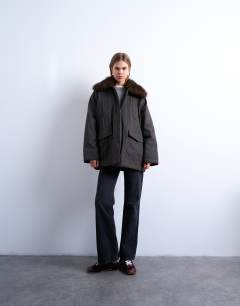 Model wearing Waxy shacket with faux fur collar in chocolate