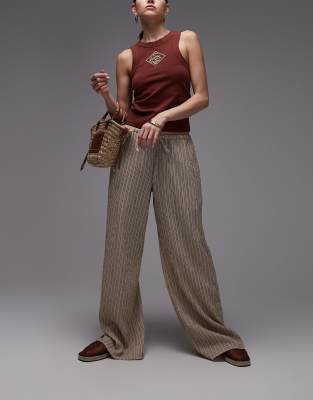 Topshop - Weite Hose in Orange mit Knitteroptik, niedrigem Bund, Bindeband und Streifen