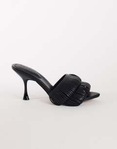 Model wearing Wendy looped fringe heeled sandal in black
