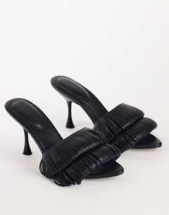 Model wearing Wendy looped fringe heeled sandal in black