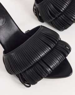 Model wearing Wendy looped fringe heeled sandal in black