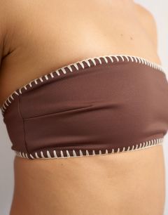 Model wearing Whipstitch bandeau  bikini top in chocolate and cream
