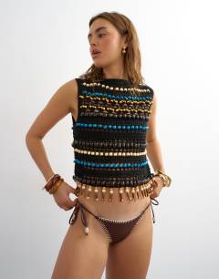 Model wearing Whipstitch thong bikini bottoms in chocolate and cream