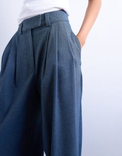 Model wearing Wide pleat suit trousers in navy