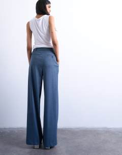 Model wearing Wide pleat suit trousers in navy