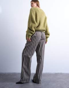 Model wearing Wide stripe pull on straight leg trouser in green and brown