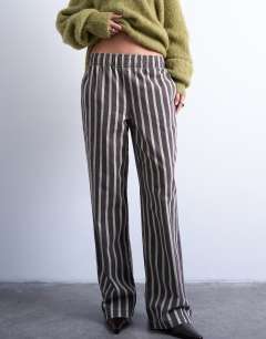 Model wearing Wide stripe pull on straight leg trouser in green and brown
