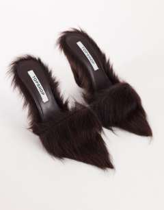 Model wearing Willa cone heel mule in chocolate hair on real leather 