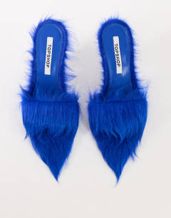 Model wearing Willa cone heel mule in cobalt hair on real leather