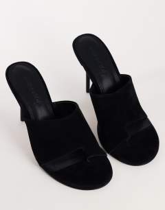 Model wearing Winnie real suede toe post heeled mule in black
