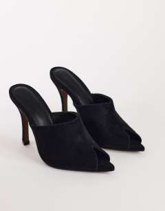 Model wearing Winona high vamp peep toe heeled sandal in black suede