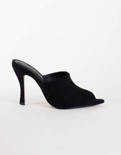 Model wearing Winona high vamp peep toe heeled sandal in black suede