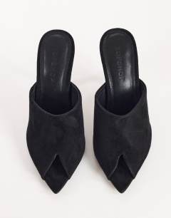 Model wearing Winona high vamp peep toe heeled sandal in black suede