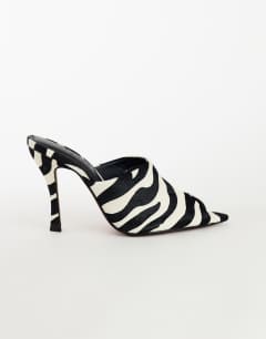 Model wearing Winona high vamp peep toe heeled sandal in zebra hair on real leather