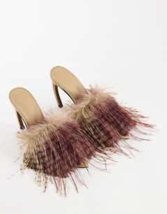 Model wearing Winter faux fur peep heeled sandal in beige