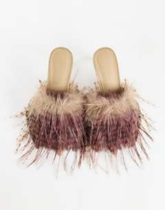 Model wearing Winter faux fur peep heeled sandal in beige