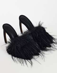 Model wearing Winter faux fur peep heeled sandal in black