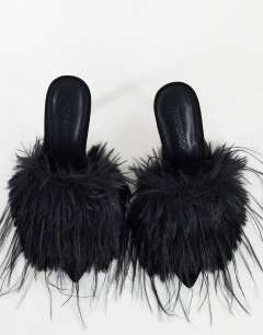 Model wearing Winter faux fur peep heeled sandal in black