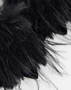 Model wearing Winter faux fur peep heeled sandal in black