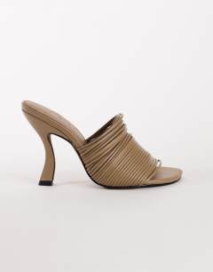 Model wearing Wisteria strappy heeled mule in taupe