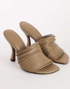 Model wearing Wisteria strappy heeled mule in taupe