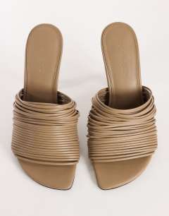 Model wearing Wisteria strappy heeled mule in taupe