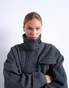 Model wearing Wool look funnel neck bomber jacket with tab detail in charcoal