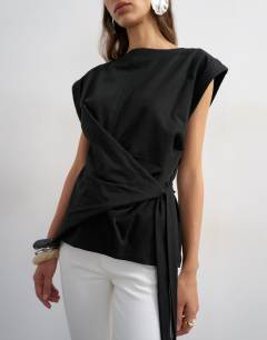 Model wearing Wrap detail cap sleeve top in black