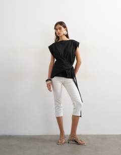 Model wearing Wrap detail cap sleeve top in black