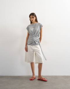 Model wearing Wrap detail cap sleeve top in grey marl