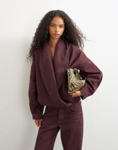 Model wearing Wrap drape neckline bomber jacket in aubergine