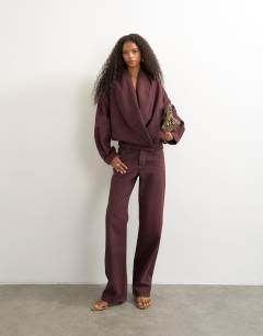 Model wearing Wrap drape neckline bomber jacket in aubergine