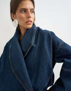 Model wearing Wrap drape neckline bomber jacket in sulphur blue