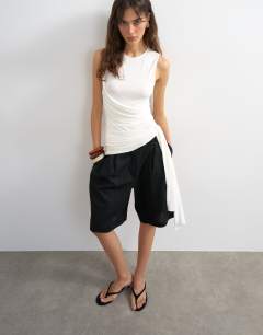 Model wearing Wrap drape tank with tie in ecru