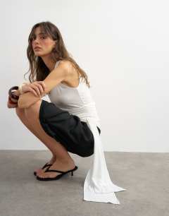 Model wearing Wrap drape tank with tie in ecru