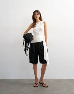 Model wearing Wrap drape tank with tie in ecru