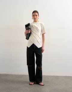 Model wearing Wrap front half sleeve top in ecru