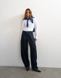 Model wearing Wrap front jean in indigo