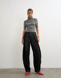 Model wearing Wrap Front jean washed black