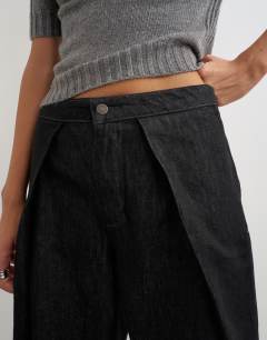 Model wearing Wrap Front jean washed black