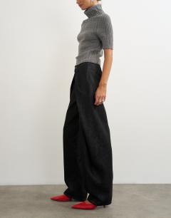 Model wearing Wrap Front jean washed black
