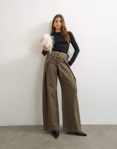 Model wearing Wrap front tie tailored jean in olive