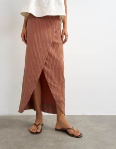 Model wearing Wrap maxi skirt in rust stripe