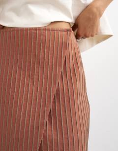 Model wearing Wrap maxi skirt in rust stripe